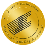 The gold, circular Joint Commission seal.
